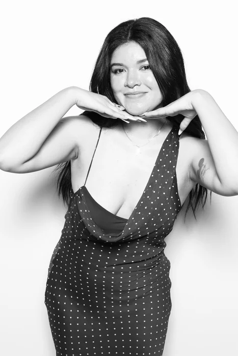 A black and white glam photo booth portrait of a guest